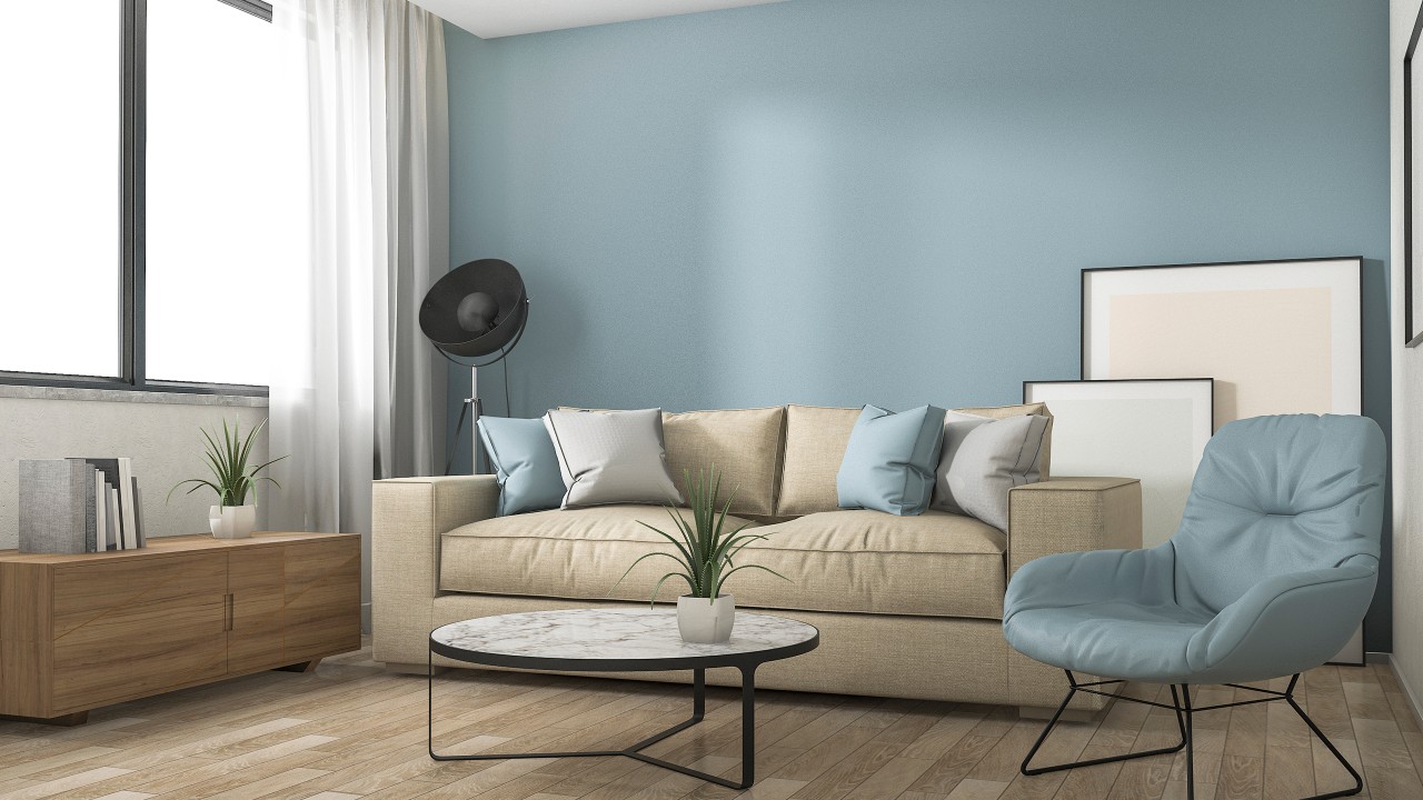 A blue modern living room; image used for mortgage assistance