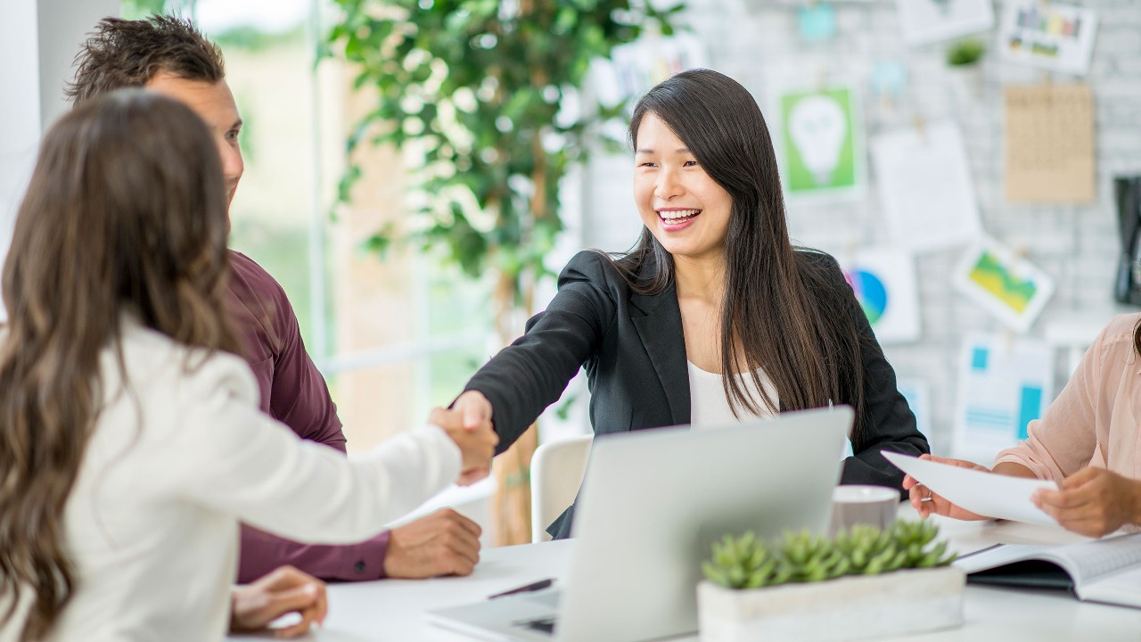 Women shaking hands; image used for About HSBC Life "Professional team".